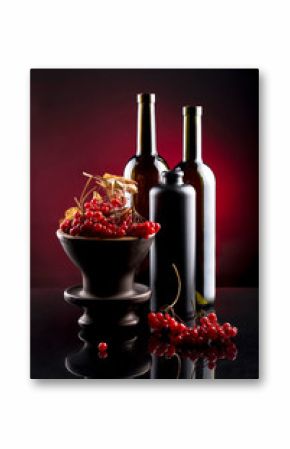 Still life with berries of viburnum red and bottles