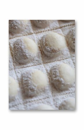 Close-up full frame of fresh homemade sheet of stuffed Sorrentino (ravioli) pasta