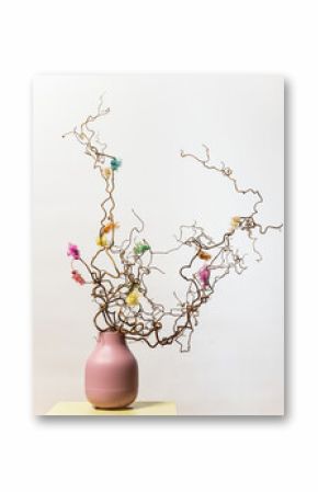 Artistic floral arrangement with dried curly twigs.