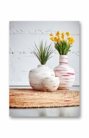 White and Red Striped Vases with Yellow Flowers on a Jute Rug