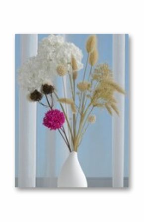 Dried Flower Arrangement in White Vase on White Table