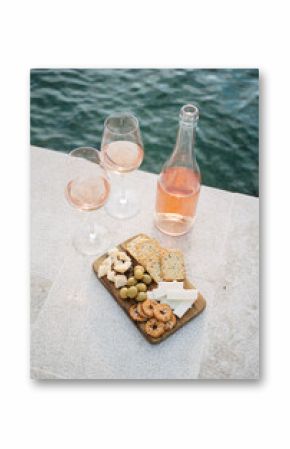 rose wine with snacks by the sea