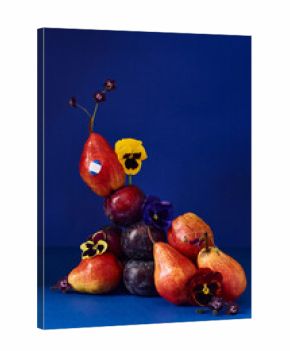 Colorful fruit arrangement with pears and flowers