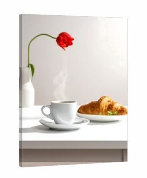 A close-up shows a coffee cup with steam, a croissant on a plate, and a red tulip in a white vase. Morning light