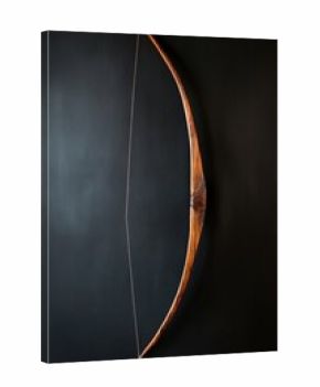 Vintage wooden bow on dark background