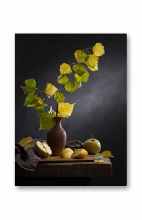 Village still life with birch branches and apples on a dark background
