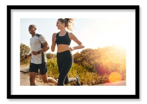 Fitness, running and health with couple in road for workout, cardio performance and summer. Marathon, exercise and teamwork with black man and woman runner in nature for sports, training and race