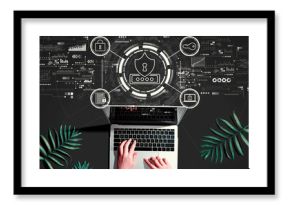 Cyber security theme with person using a laptop computer