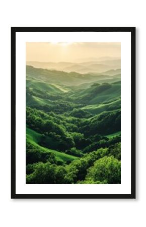 A view of rolling green hills and a forest during sunset.