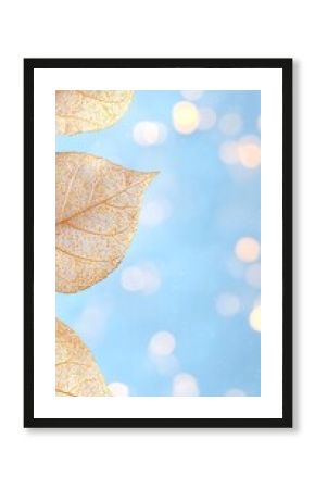 Golden Glitter Leaves on Blue Gradient Background