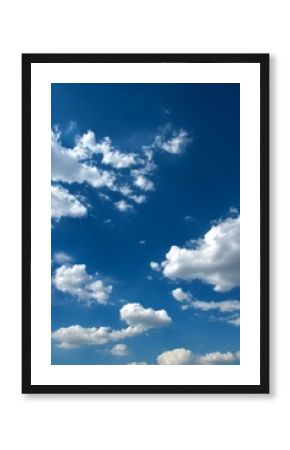 The background is a vertical image of a blue sky with white clouds that is beautiful