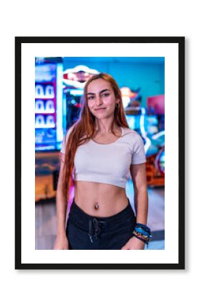 Young woman enjoying weekend at the arcade, entertainment and fun