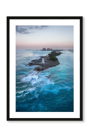 Exposure done at sunset of the Nassau Harbour Lighthouse near Colonial Beach, built in 1847, with the awesome turquoise blue waters surrounding the beautiful island of the Bahamas