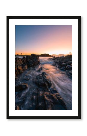 Beautiful wave flow on the rocky coastline of Crescent Head, NSW, Australia.