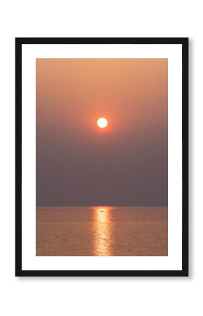 The sun above the sea at sunset. sparkling ripple, sun glitter, water shimmering