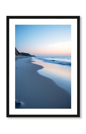 serene beach scene dawn cool blue white gradient sky reflecting calm waters shot low angle shallow depth