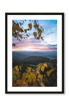Beskydy mountains at colorful sunset. Autumn forest, rolling hills and peaceful valley evoke freedom, adventure and calm outdoor lifestyle