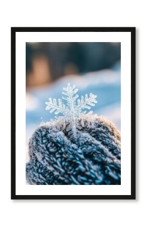 Snowflake on wool glove in winter landscape