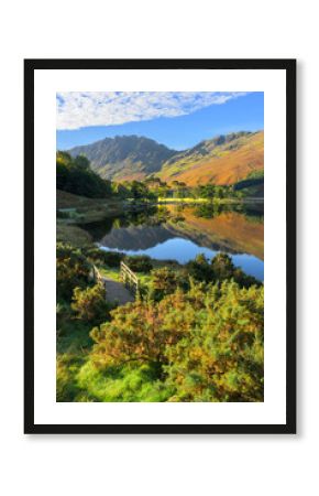 Buttermere lake reflections in the Lake District National Park on an autumn morning.