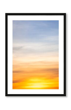 Sunset or sunrise sky with a vibrant gradient of orange, gold, and soft blue. Clear atmosphere with wispy clouds. Peaceful, natural light background. hope, freedom, new day Concepts, Vertical