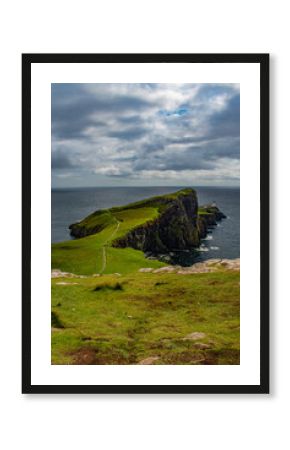 Scotland: view of the sheer cliff of Neist Point lighthouse (1909), famous promontory and viewpoint on the most westerly point on the Duirinish peninsula on the Isle of Skye