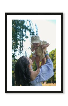 Mother and Baby Enjoying Sunny Day in Park Soft Light