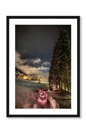 Scenic view of illuminated Wolkenstein in Gröden Selva in Val Gardena covered with snow at night