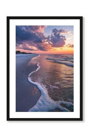 A breathtaking sunset over the Gulf Coast with gentle waves and colorful clouds reflecting on the shoreline