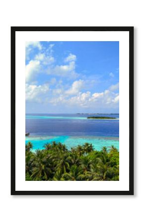 Scenic panoramic view of tropical islands surrounded by deep blue ocean with palm trees in the foreground, maldives summer travel, island getaway, nature beauty