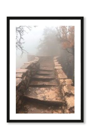 Stone Steps Leading Upward Through Foggy Mountain Landscape