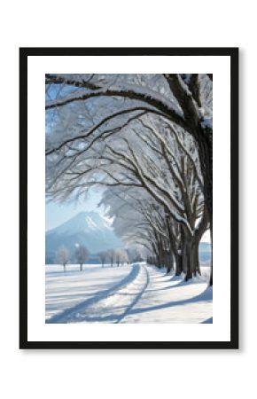 Snow covered trees lining a winter road with mountain view