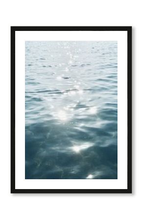 Blue morning light reflecting on calm ocean at dawn.  