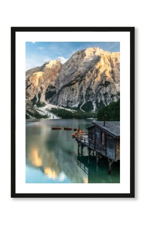 Calm Reflection at Lago di Braies or Pragser Wildsee at sunset.