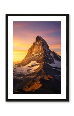 Sunlight hitting a dramatic mountain peak at golden hour