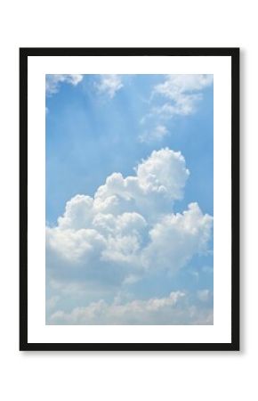Summer Blue Sky with Puffy White Clouds Illuminated by Sunlight