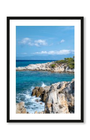 Turquoise beach with rocks . Portokali beach, Sithonia,  Halkidiki, Greece . Sea background 