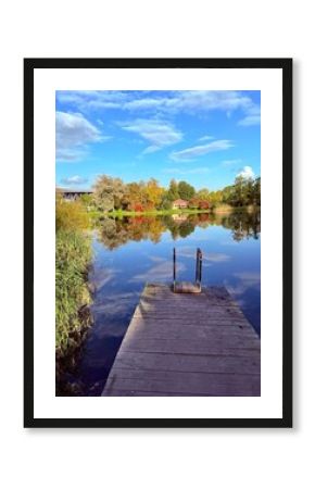 autumn trees reflection on the blue lake surface, autumn lake in the park