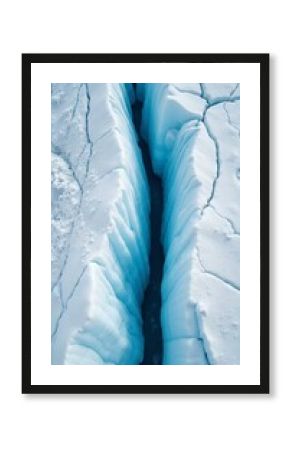 Majestic glacier with blue ice crevices and intricate patterns on white surface