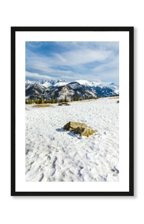 Mountain glade in winter scenery.    Picnic tables with banches   inn white winter  landscape of  Hight Tatra Mountains. Hiking trawl to Rusinowa glade, Tatra Mountain , Poland 