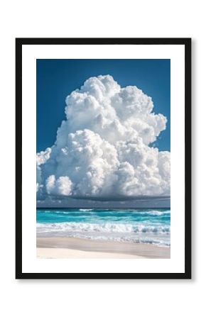 Serene beach vista with turquoise water gentle waves white sand and a massive cumulus cloud formation against a clear blue sky