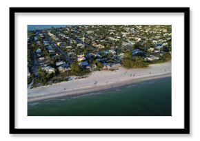 Aerial view of the coastline in Rehoboth Beach occupied by small buildings