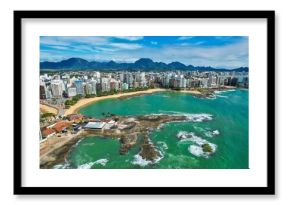 the beach and city skylines in puerto, with green waters