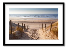 sand path to North sea at sunset