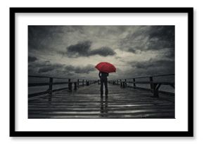 Red umbrella in storm