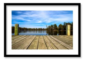 Summer Day At The Lake. Wooden dock overlooking a gorgeous lake in the wilderness. Ludington State Park. Ludington, Michigan.