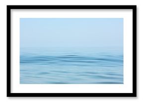 Calm sea surface. Seascape in early morning hours under clear skies.