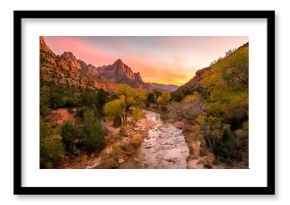 The rays of the sun illuminate red cliffs and river. Park at sunset. A beautiful pink sky. Zion National Park, Utah, USA