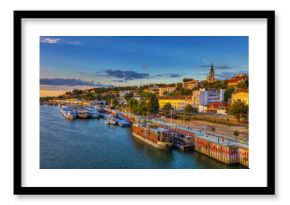 Sunset over Belgrade and ships in the harbor. HDR image