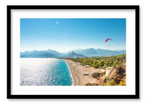 Panoramic bird view of Antalya and Mediterranean seacoast and beach with a paraglider, Antalya, Turkey