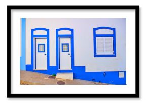 Portugal, Algarve, Arrifana, Pair of entrance doors of clean white and blue house